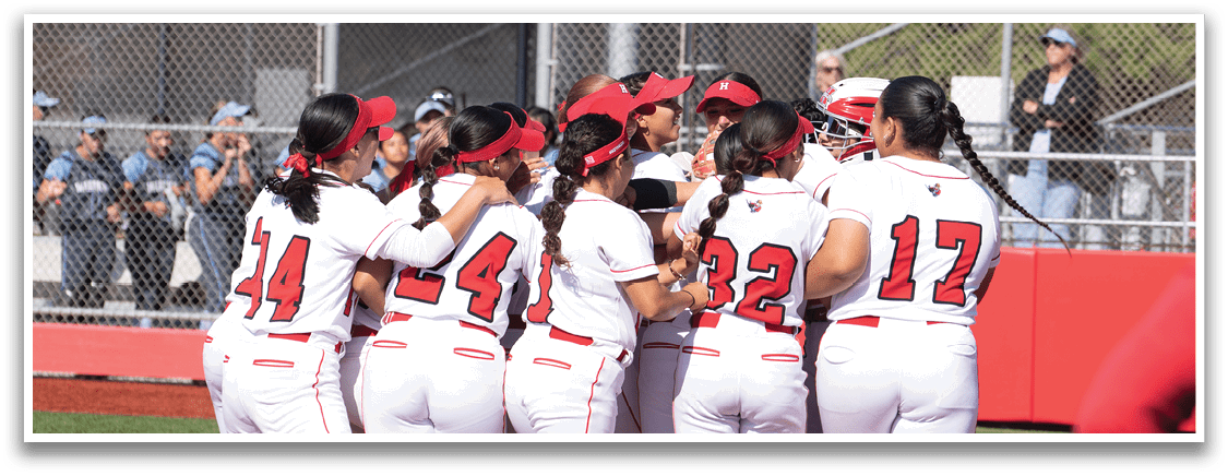 A group of women wearing red and white uniforms hugging each other. Description generated by AI