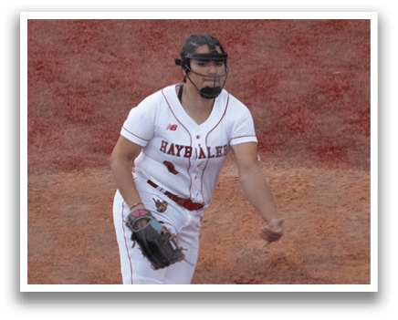 A baseball player in a red and white uniform is pitching a ball. Description generated by AI