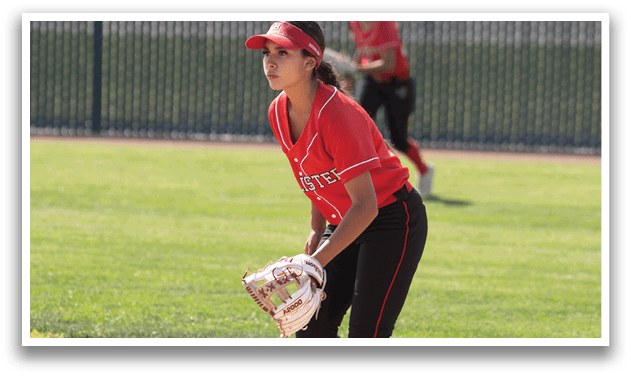 A person wearing a white and red uniform is standing on a baseball field. Description generated by AI