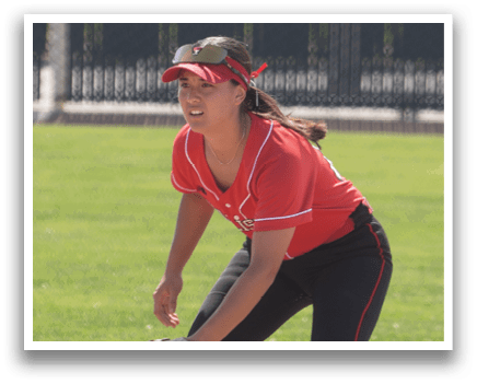 A baseball player in a red and white uniform is pitching a ball. Description generated by AI