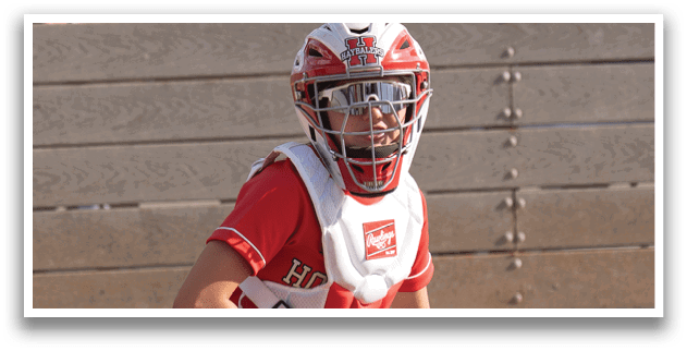A female baseball player is swinging a bat at a ball. Description generated by AI