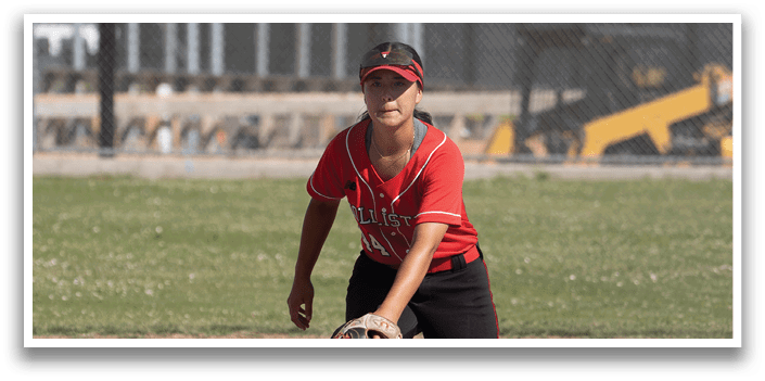 A baseball player is holding a bat and standing on the field. Description generated by AI