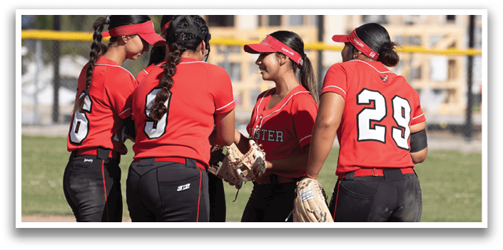 A female baseball player is swinging a bat at a ball. Description generated by AI