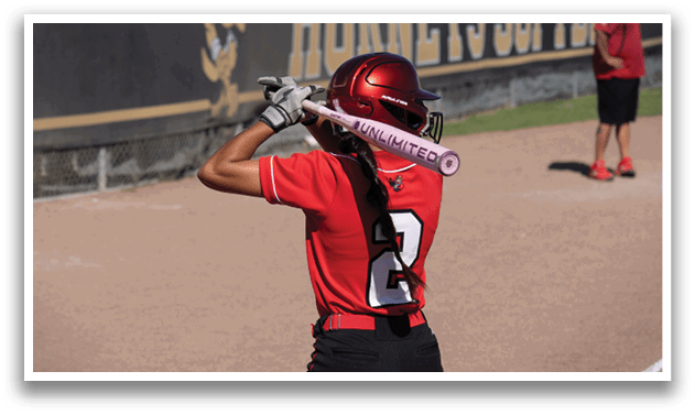A person wearing a white and red uniform is standing on a baseball field. Description generated by AI