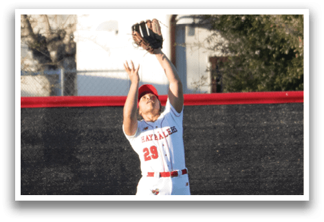 A baseball player catching a ball in a field. AI generated content