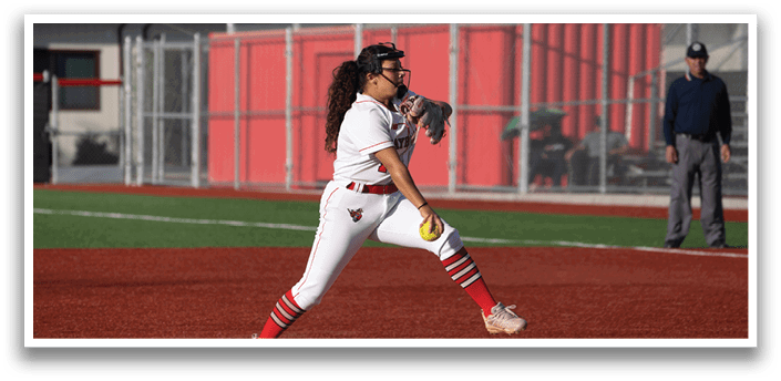 A female baseball player in a white and red uniform is pitching a ball on a field. AI generated content