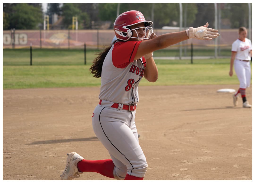A female baseball player in a red and white uniform is throwing a ball. AI generated content