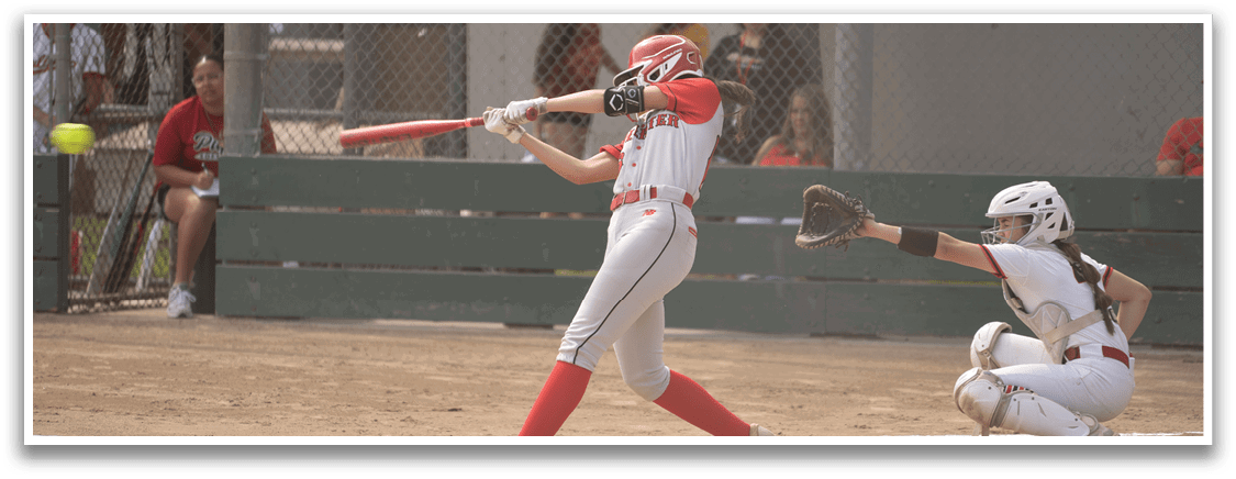 A female baseball player is swinging a bat at a ball, while a catcher is positioned behind her. There are several other people in the scene, some of whom are watching the game. AI generated content