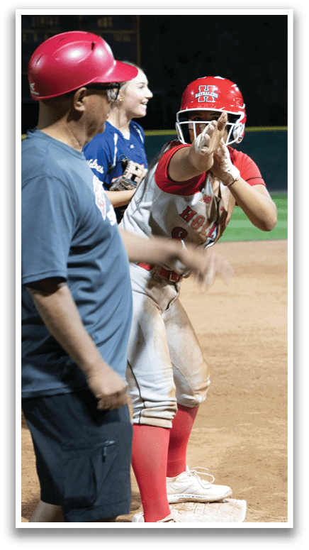 A baseball player wearing a red helmet and red shoes is standing on the field. AI generated content