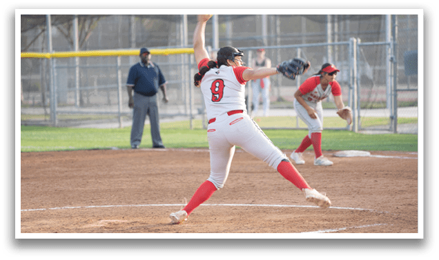 A female baseball player in a white and red uniform is pitching a ball on a field. AI generated content