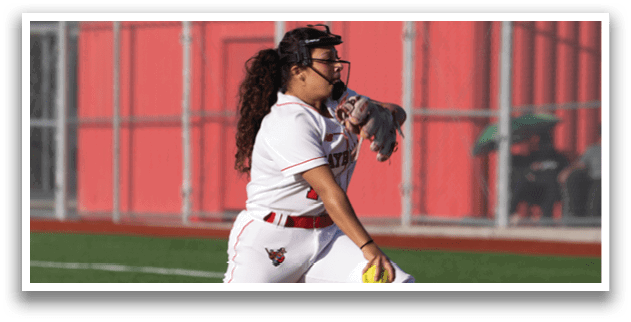A female baseball player in a white and red uniform is pitching a ball. AI generated content