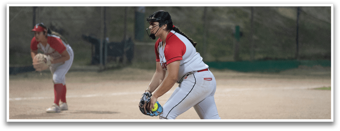 A baseball player in a red and white uniform is pitching a ball. AI generated content