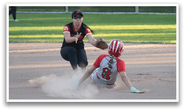 A female baseball player slides into a base, while another player tries to tag her out. AI generated content