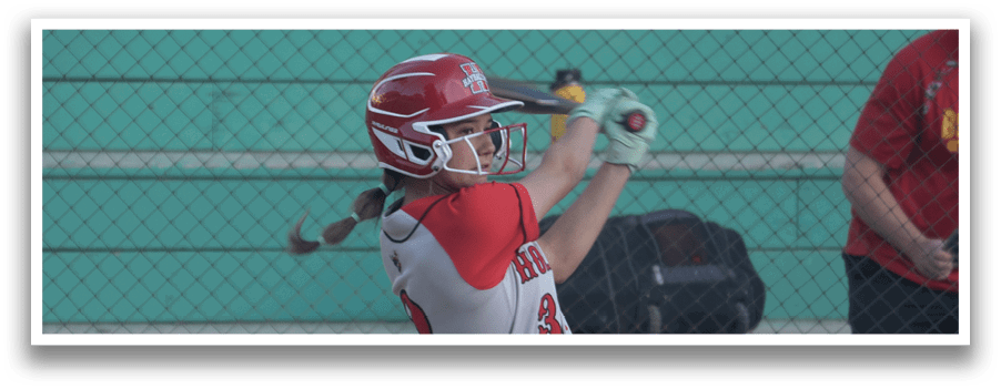 A woman is swinging a baseball bat on a field. AI generated content