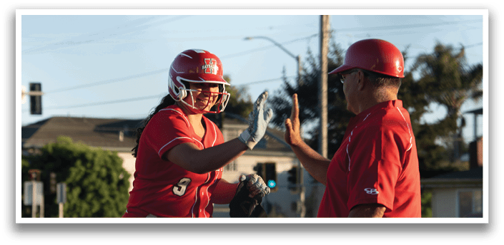 A woman in a red baseball uniform is shaking hands with a man in a red shirt. AI generated content
