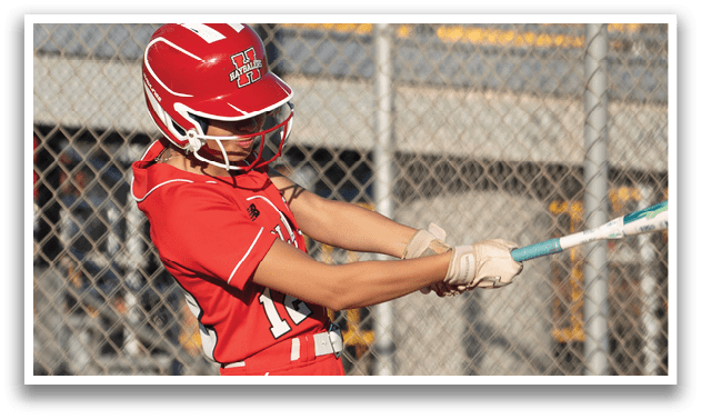 A baseball player in a red uniform is swinging a bat, attempting to hit a ball. AI generated content