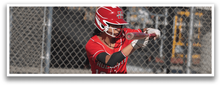 A female baseball player in a red uniform is swinging a bat at a ball. AI generated content