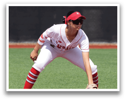 A baseball player is crouching on the field, wearing a white uniform and red socks. Another player is standing behind him, both players are wearing baseball gloves. AI generated content