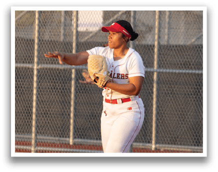 Two female softball players are playing on a field. One player is throwing a ball while the other is catching it. AI generated content