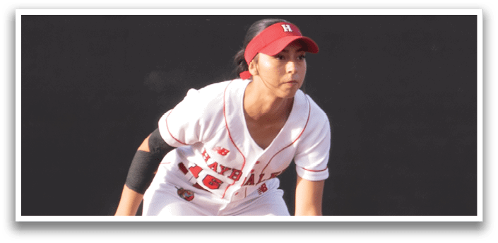 Two baseball players are on the field, one of them is wearing a red hat. AI generated content