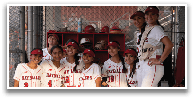 A group of female softball players pose for a picture. AI generated content