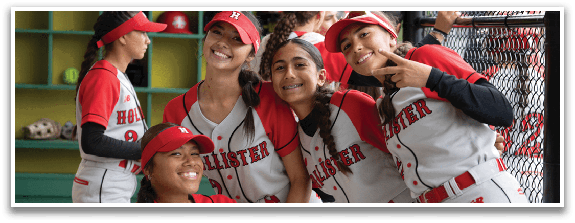 A group of girls wearing red and white uniforms. Description generated by AI