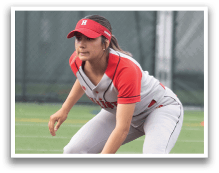 A girl in a red and white uniform is playing baseball. Description generated by AI