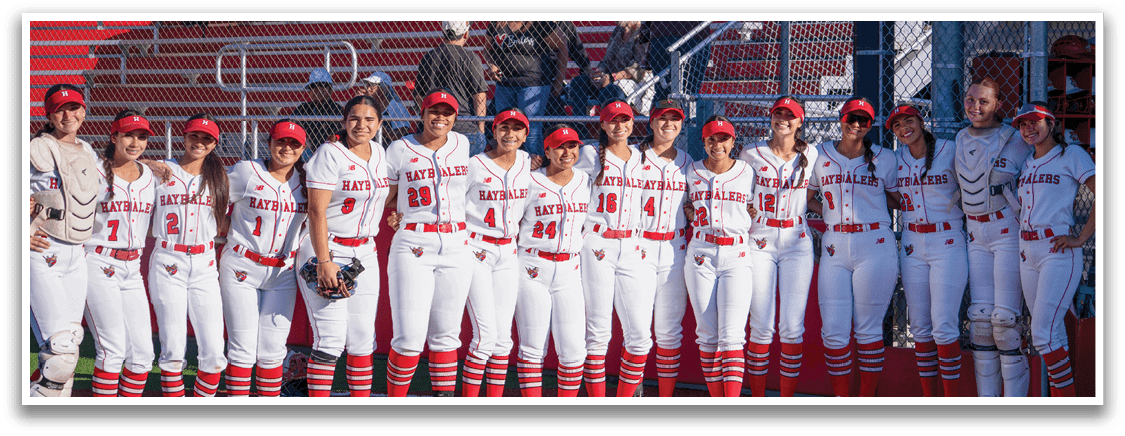 A group of women wearing red and white uniforms. Description generated by AI