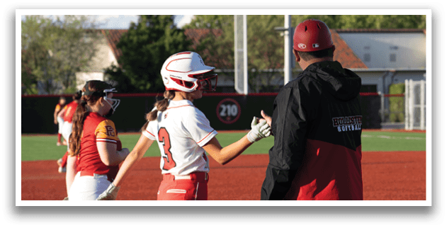 A group of girls playing softball. Description generated by AI