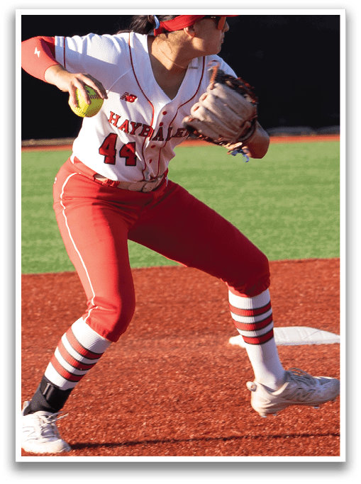 A girl is running on a baseball field. Description generated by AI