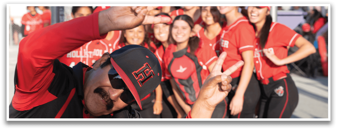 A man wearing a red and black shirt with a black hat. Description generated by AI