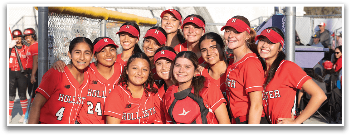 A group of girls wearing red and black uniforms. Description generated by AI