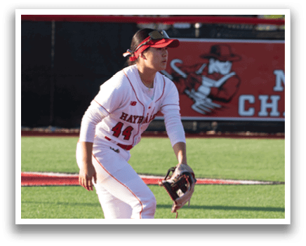 A baseball player in a red and white uniform is running on a field. Description generated by AI