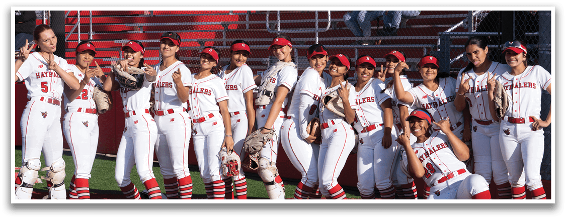 A group of women wearing red and white uniforms. Description generated by AI