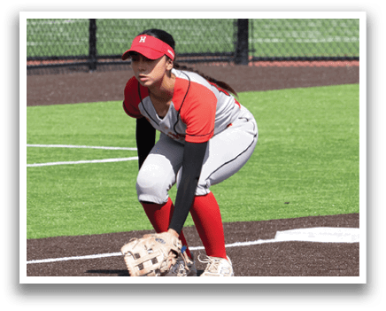 A baseball player is crouching on the field. Description generated by AI