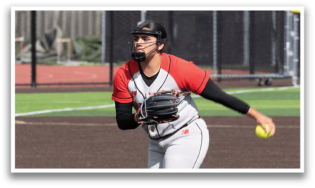 A woman in a red shirt and white pants is playing baseball. Description generated by AI