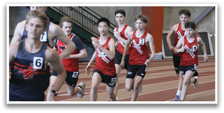 A group of young men wearing red shirts and black shorts are running on a track. AI generated content