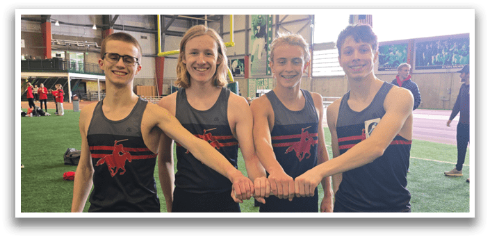 Four young men pose for a picture on a field, wearing athletic clothing and holding hands. AI generated content