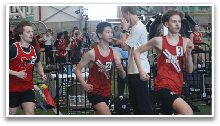 Two men are running on a track, one wearing a red shirt and the other in a white shirt. They are both running towards a finish line. AI generated content