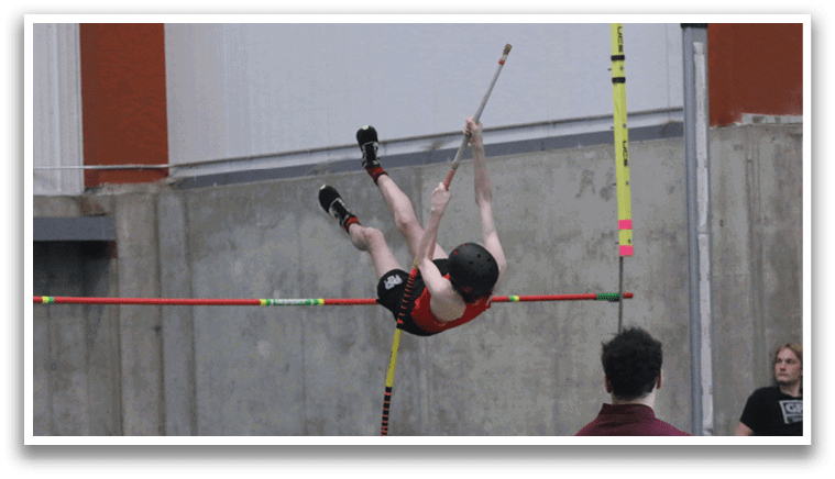 A man is jumping in the air over a pole, possibly in a gymnastics competition. AI generated content