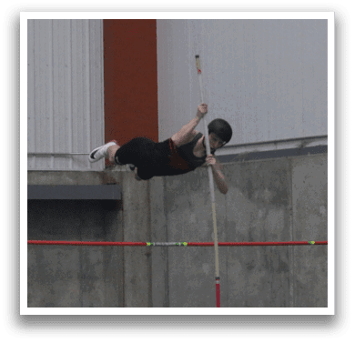 A man is seen jumping over a pole in a gym, while others watch. AI generated content