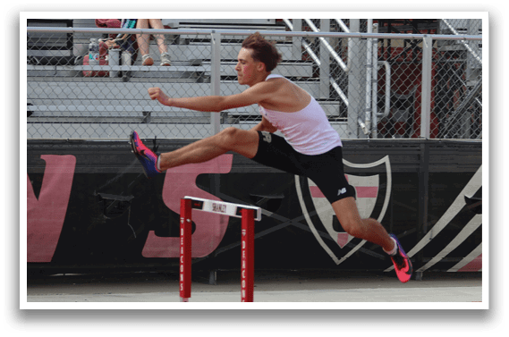 A man is jumping over a hurdle. Description generated by AI