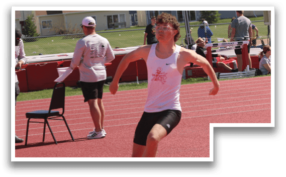 A boy running on a track. Description generated by AI