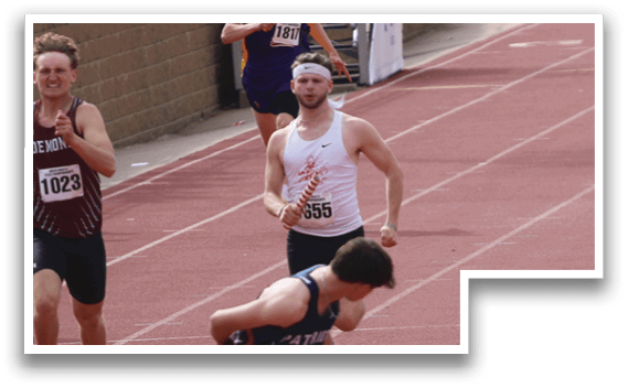 A group of people running on a track. Description generated by AI