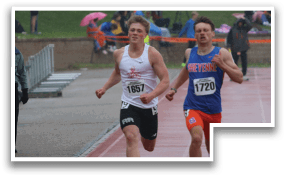 A man running on a track in the rain. Description generated by AI