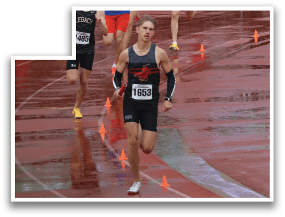 A group of runners on a track. Description generated by AI