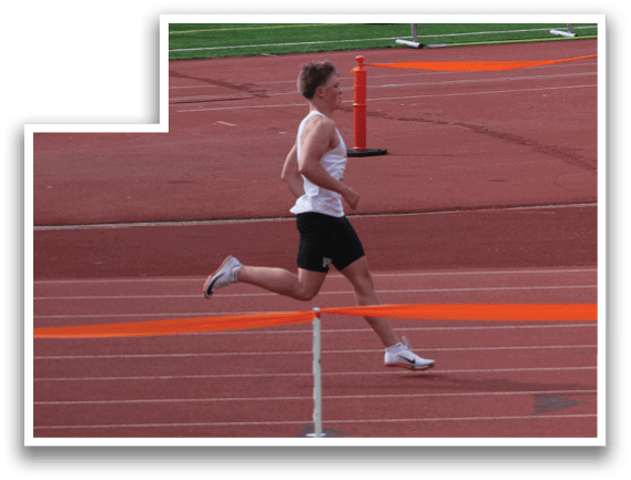 A man running on a track. Description generated by AI