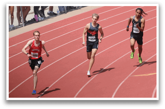 Two runners on a track. Description generated by AI