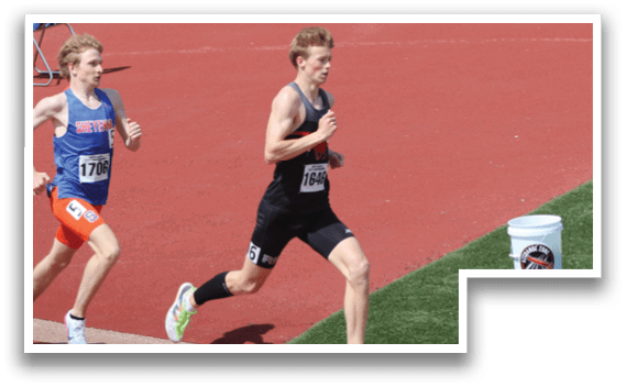A group of runners are running on a track. Description generated by AI