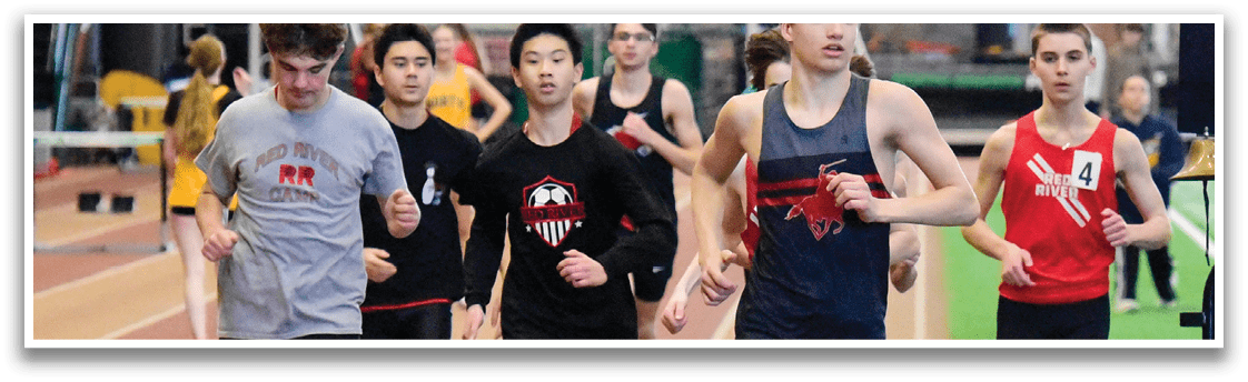 A group of young men are running on a track, with one of them leading the pack. AI generated content